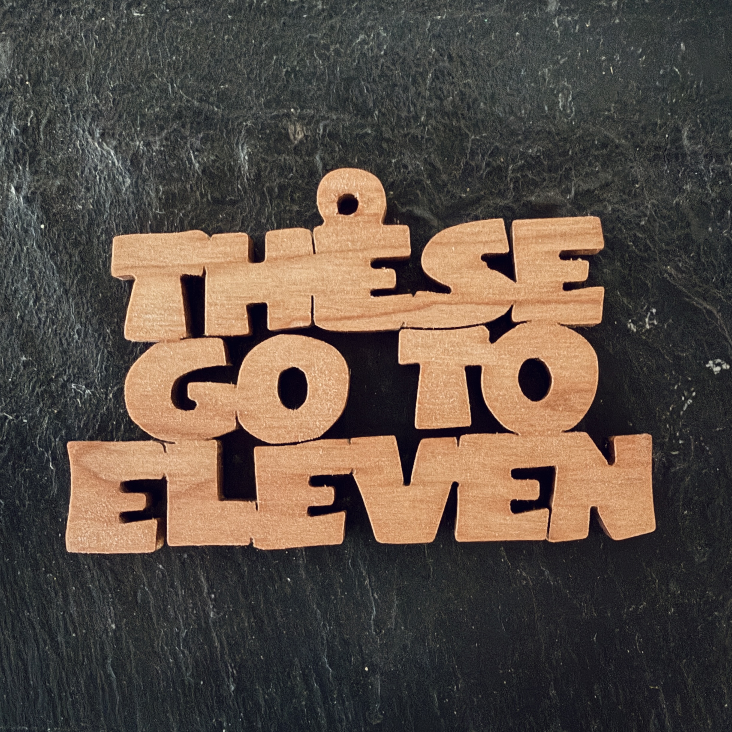 these go to eleven Scrolling It Out Ornaments